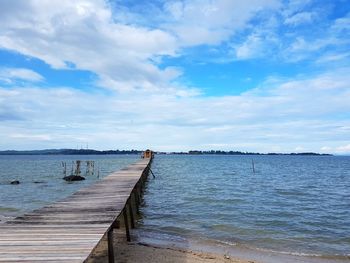 Pier over sea against sky