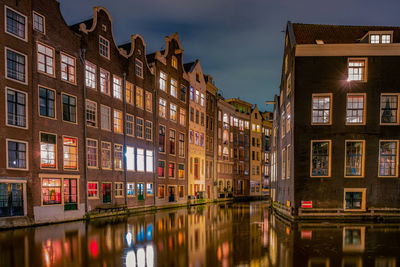 Reflection of building in city at night