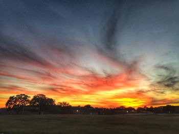 Scenic view of landscape against sky at sunset