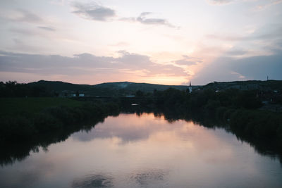 Scenic view of lake against sky during sunset