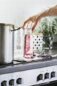 Midsection of person preparing food at home