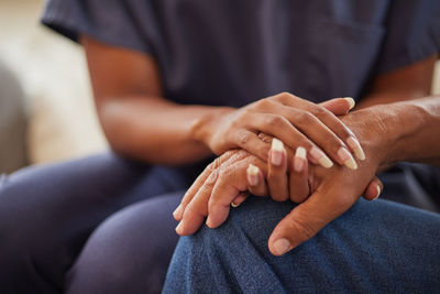 Midsection of man massaging woman