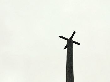 Low angle view of windmill against clear sky