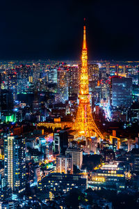 Illuminated buildings in city at night