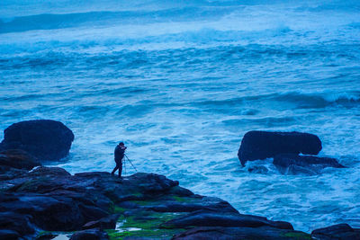 Man standing on seashore