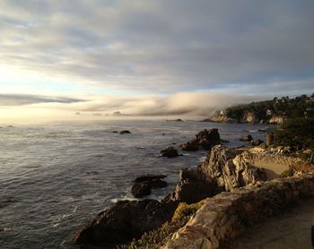 Scenic view of sea against cloudy sky