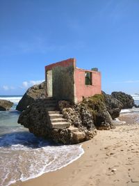 Abandonded building at bathshedba beach in barbados. slowly being taken by nature.