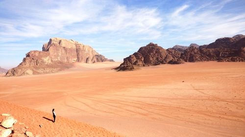 Scenic view of arid landscape against sky