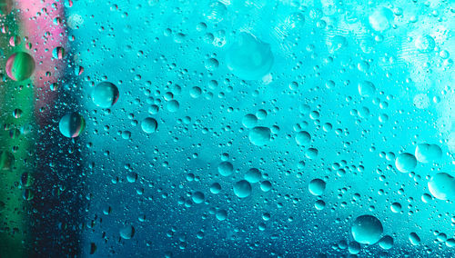 Close-up of raindrops on glass window