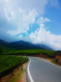 Scenic view of mountains against cloudy sky