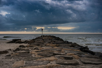 Scenic view of sea against cloudy sky