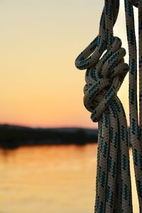 Close-up of rope tied on wooden post