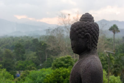 Statue of buddha against sky