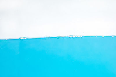 Close-up of bubbles over sea against sky