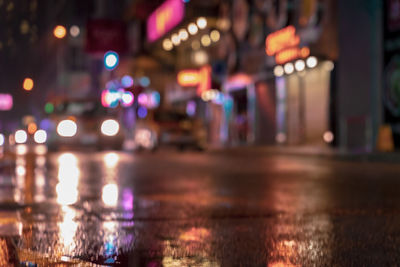 Illuminated city street at night