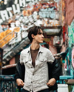 Man looking away while standing in market