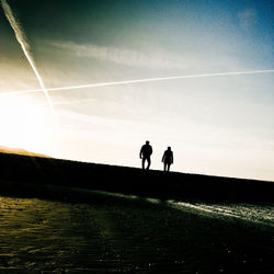 Men on field against sky