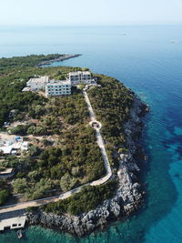 High angle view of sea and trees against sky