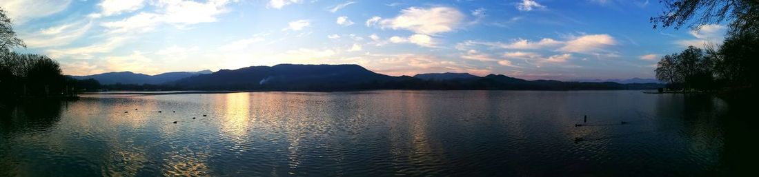 Scenic view of lake against sky during sunset