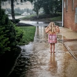 Full length of woman standing in water