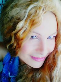 Close-up portrait of smiling young woman