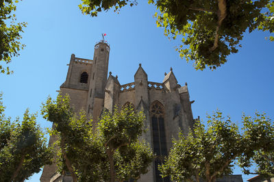 Low angle view of church against blue sky