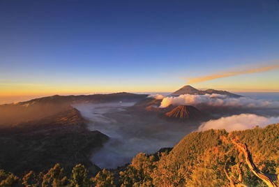 View of volcanic landscape against sky during sunset