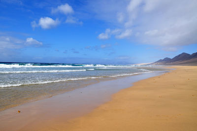 Scenic view of beach against sky