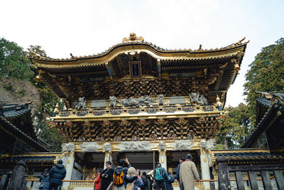 Group of people in temple against building