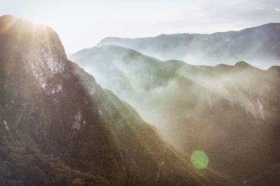 Scenic view of mountains in foggy weather