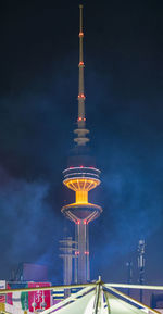 Low angle view of illuminated building against sky at night