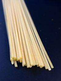 High angle view of pasta on table against black background