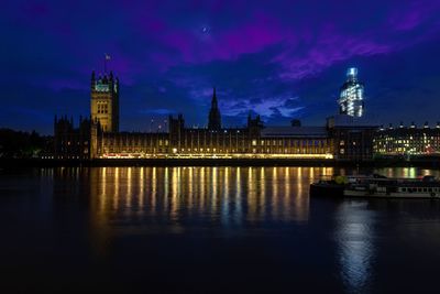 Illuminated buildings in city at night