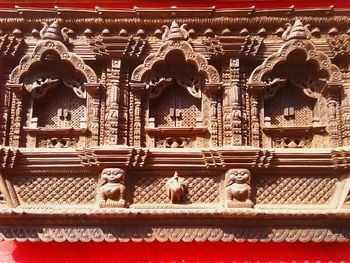 Low angle view of statue against temple