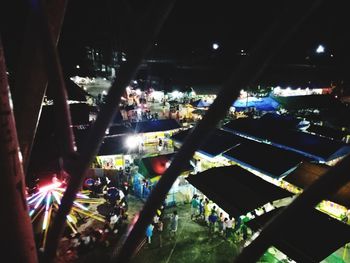 Low angle view of crowd at music concert at night