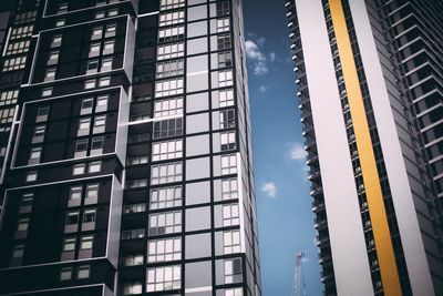 Low angle view of modern building in city against sky