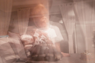 Close-up of young woman in mirror at home