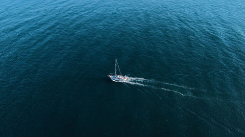 High angle view of sailboat sailing in sea