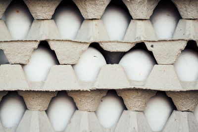 Stack of eggs in cartons for sale at market