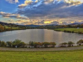 Scenic view of lake against sky during sunset