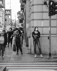 Full length of woman standing on street