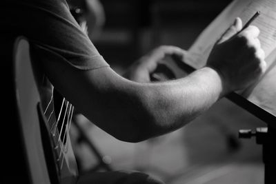 Close-up of hands playing guitar