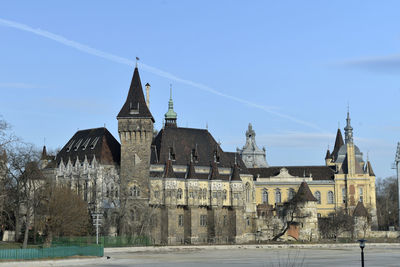 Buildings in city against sky