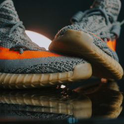 Low section of woman wearing mask on table