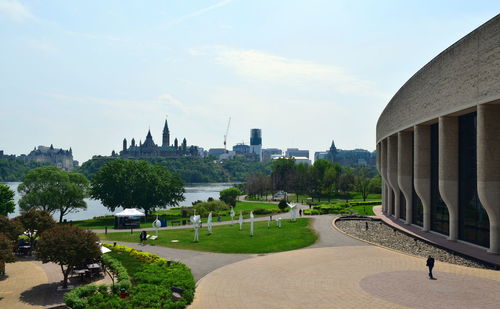 Park in city against sky