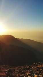 Scenic view of mountains against sky during sunset