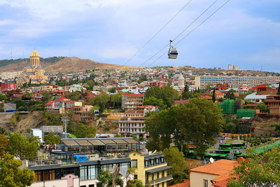 Stunning aerial view of tbilisi with the cable car from downtown to narikala fortress, georgia