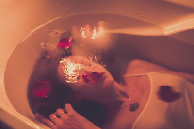 High angle view of woman in bathtub