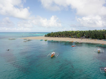 Aerial of daku island beach in siargao, philippines