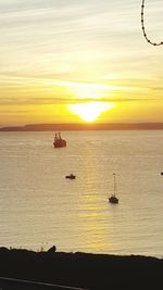 Silhouette of boat at sunset